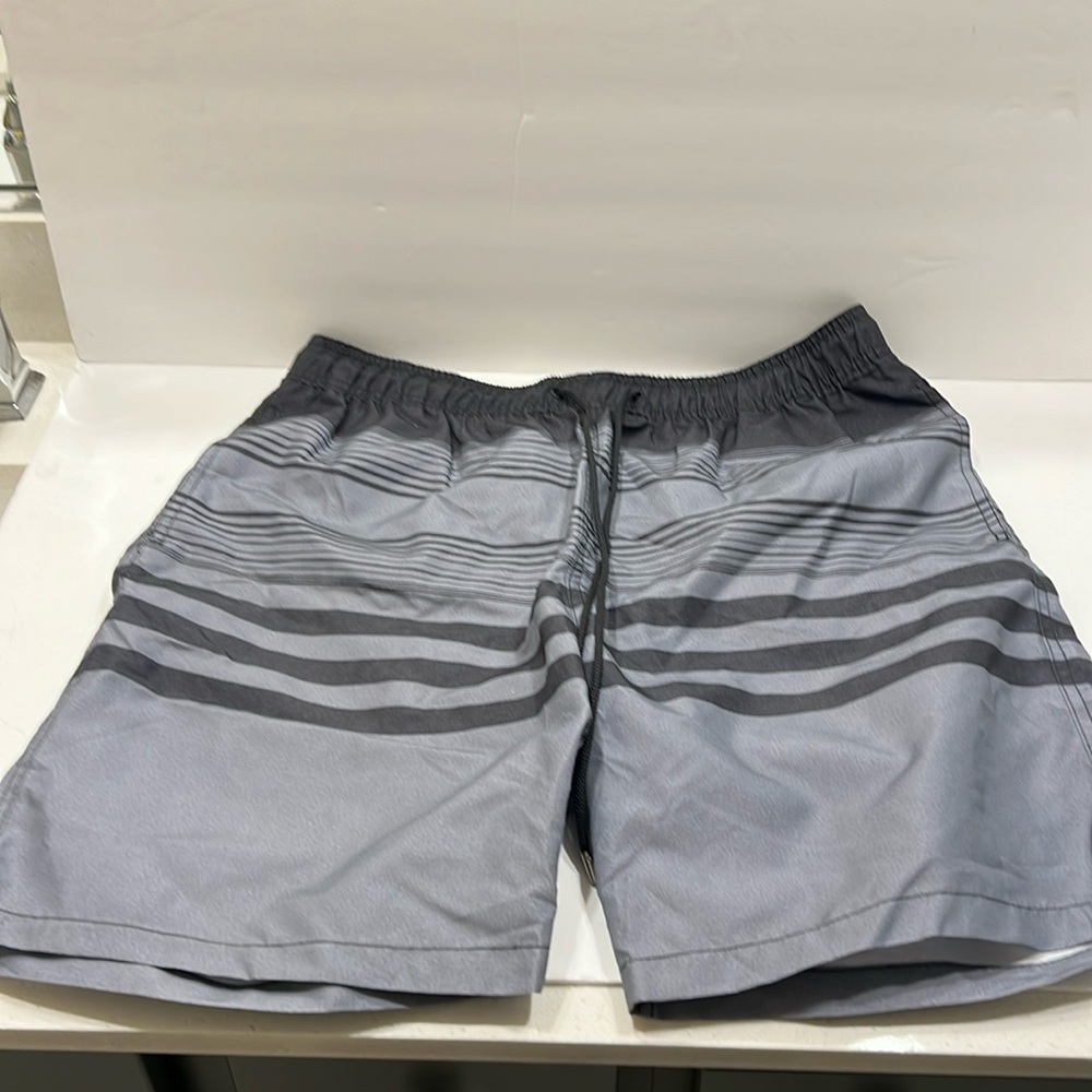 Kirkland, swimming board, shorts, gray and black size large, but can fit an XL